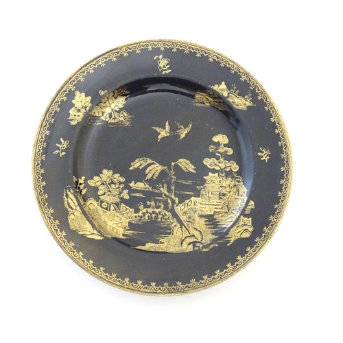 177 - A Booths Silicon China tea cup and saucer, together with two small plates with a black ground and gi... 