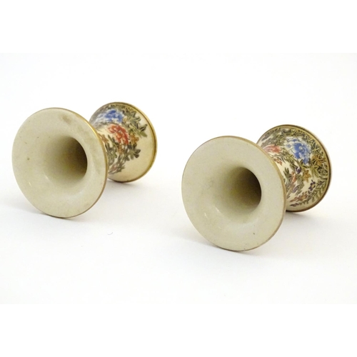 28 - A pair of Japanese miniature Satsuma vases with flared rims and bases, decorated with flowers and fo... 