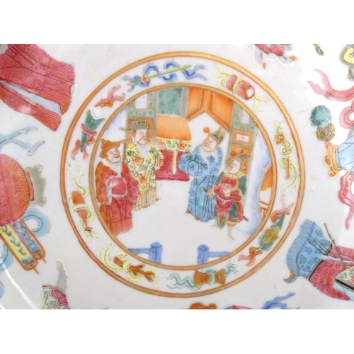 38 - A pair of Chinese famille rose plates decorated with warrior figures / heroes with auspicious symbol... 