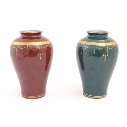 67 - A matched pair of Oriental vases with gilt banded detail. Character marks under. Approx. 9 1/2