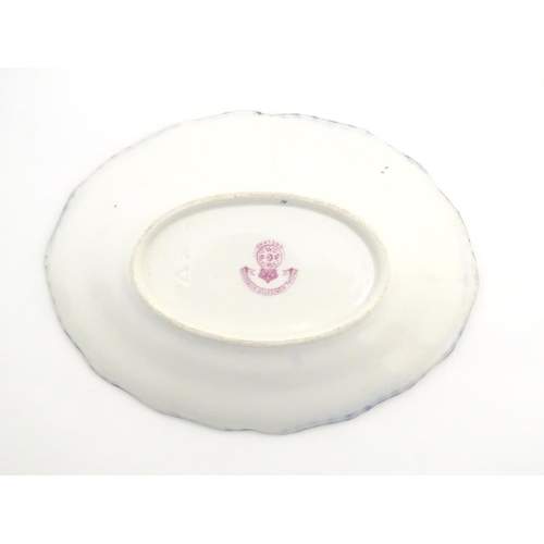 78 - A Royal Worcester dish of oval form with a lobed rim with fish detail. Marked under. Approx. 5 1/4