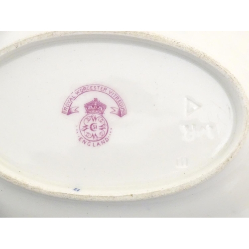 78 - A Royal Worcester dish of oval form with a lobed rim with fish detail. Marked under. Approx. 5 1/4