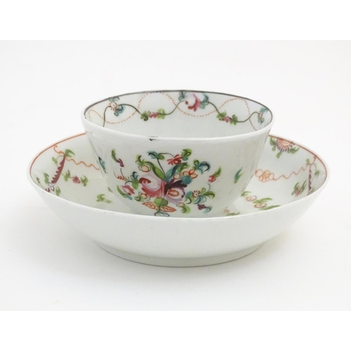 87 - A 19thC New Hall tea bowl and saucer with floral decoration, pattern no. 241. Tea bowl approx. 2