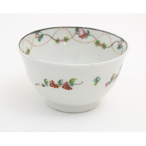 87 - A 19thC New Hall tea bowl and saucer with floral decoration, pattern no. 241. Tea bowl approx. 2