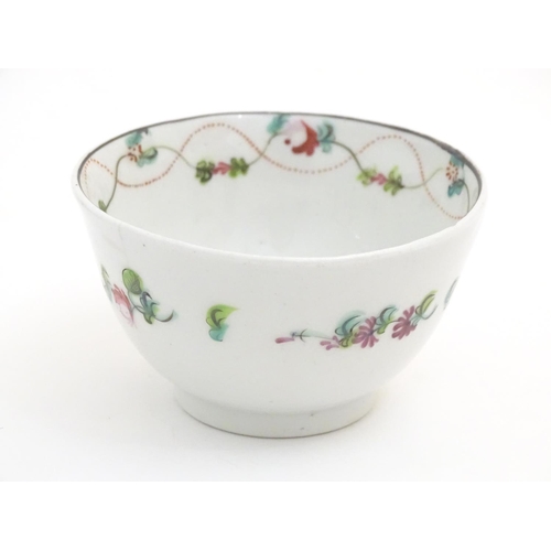 87 - A 19thC New Hall tea bowl and saucer with floral decoration, pattern no. 241. Tea bowl approx. 2