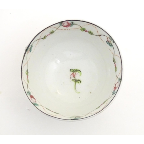 87 - A 19thC New Hall tea bowl and saucer with floral decoration, pattern no. 241. Tea bowl approx. 2