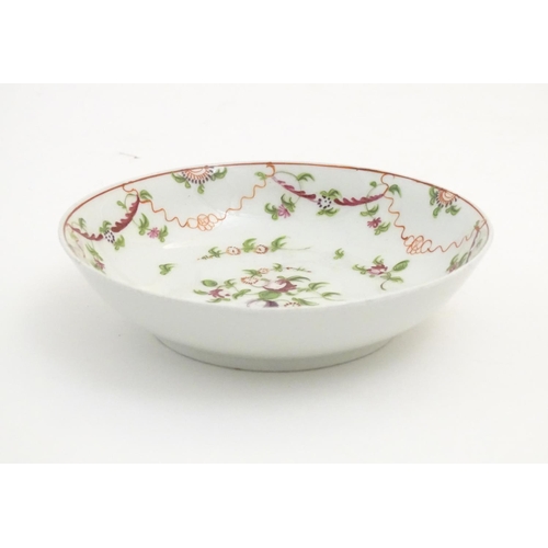 87 - A 19thC New Hall tea bowl and saucer with floral decoration, pattern no. 241. Tea bowl approx. 2