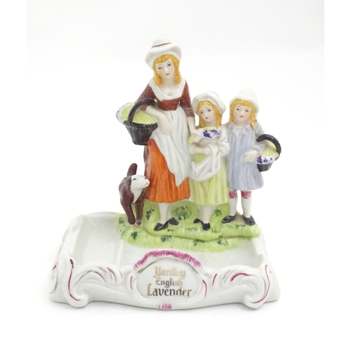 88 - A Yardley English Lavender advertising figural group depicting a woman, two children and a dog. Appr... 