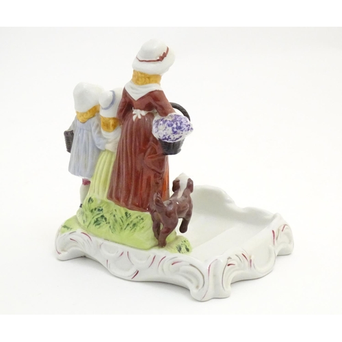 88 - A Yardley English Lavender advertising figural group depicting a woman, two children and a dog. Appr... 