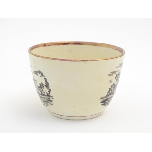 90 - A 19thC tea cup and saucer with monochrome transfer decoration depicting a river landscape with a sh... 