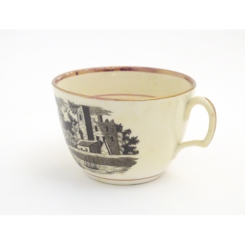 90 - A 19thC tea cup and saucer with monochrome transfer decoration depicting a river landscape with a sh... 