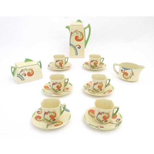 91 - A Royal Doulton Art Deco coffee set in the pattern Syren with scrolling foliate detail, comprising a... 