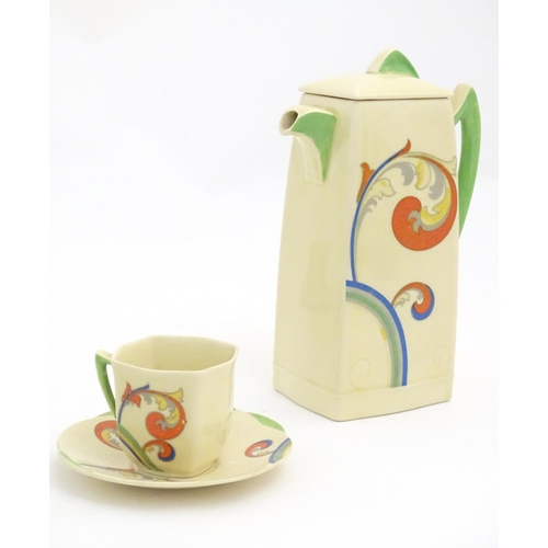 91 - A Royal Doulton Art Deco coffee set in the pattern Syren with scrolling foliate detail, comprising a... 