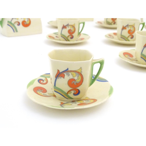 91 - A Royal Doulton Art Deco coffee set in the pattern Syren with scrolling foliate detail, comprising a... 