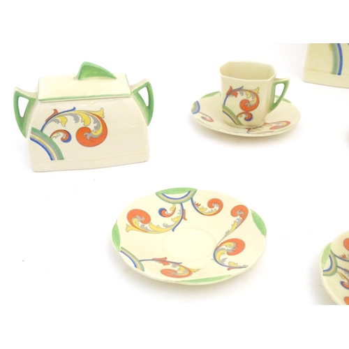 91 - A Royal Doulton Art Deco coffee set in the pattern Syren with scrolling foliate detail, comprising a... 