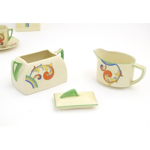 91 - A Royal Doulton Art Deco coffee set in the pattern Syren with scrolling foliate detail, comprising a... 