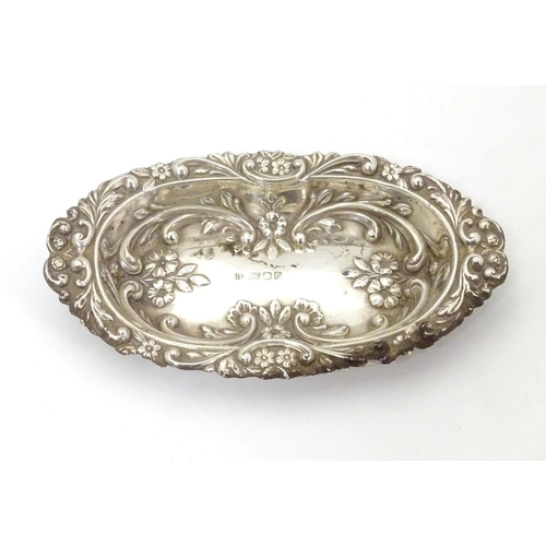 285 - A silver dish with embossed decoration, hallmarked London 1984 maker BJS. 5 1/2