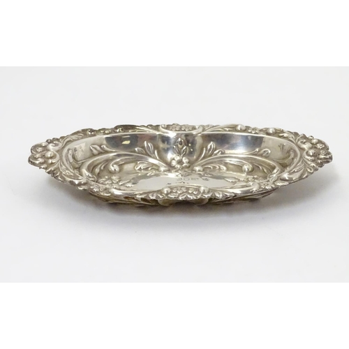 285 - A silver dish with embossed decoration, hallmarked London 1984 maker BJS. 5 1/2