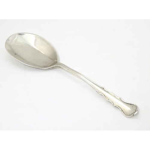 286 - A silver jam / preserve spoon, hallmarked London 1921.  4 3/4