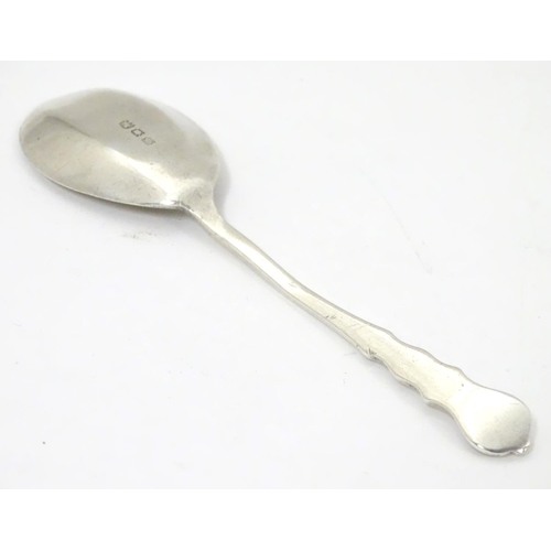 286 - A silver jam / preserve spoon, hallmarked London 1921.  4 3/4