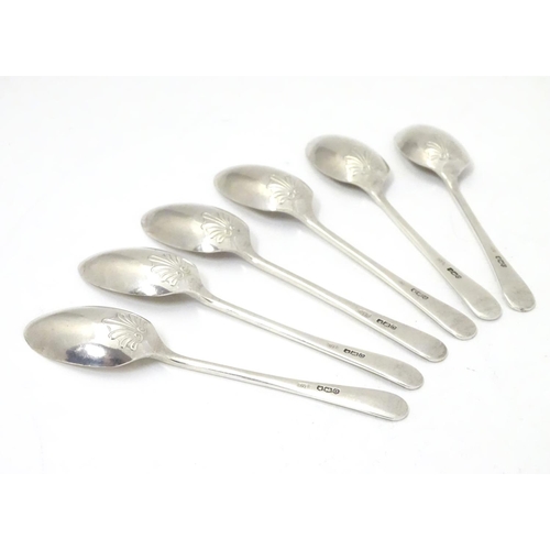 290 - A set of six silver teaspoons with shell decoration to reverse of bowls,   hallmarked Sheffield 1956... 