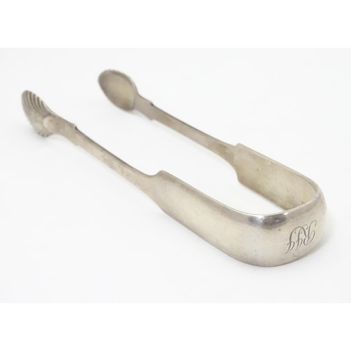 295 - Scottish Provincial silver fiddle pattern sugar tongs with shell form grips, bearing marks for Georg... 