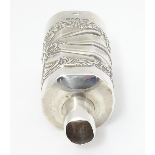 301 - A silver bottle cover with embossed detail, hallmarked London 1901 maker Goldsmiths & Silversmiths C... 