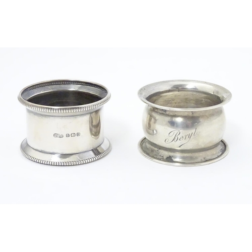 302 - Two silver napkin rings with outswept edges, one with beaded rim hallmarked Birmingham 1928 maker R ... 