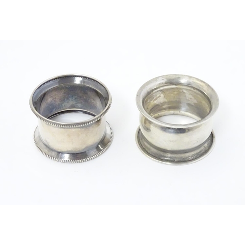 302 - Two silver napkin rings with outswept edges, one with beaded rim hallmarked Birmingham 1928 maker R ... 