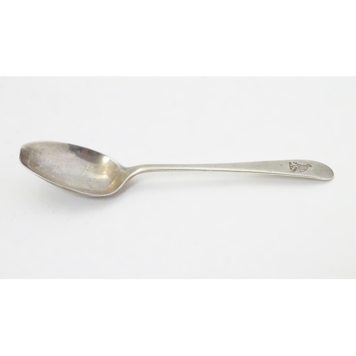 304 - A silver teaspoon with engraved decoration to handle depicting a figure playing bowls. Hallmarked  S... 