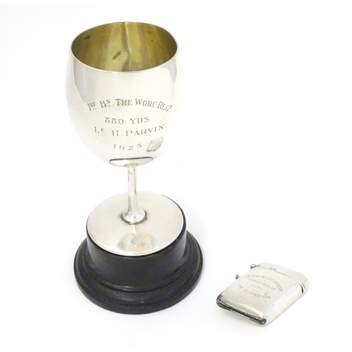 310 - A silver vesta case, hallmarked Birmingham 1919 and engraved Inter-Regimental Sports Depot Relay 192... 