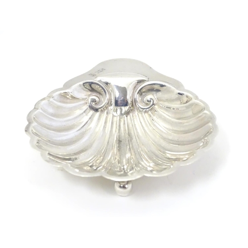 312 - A silver butter dish of shell form, hallmarked Sheffield 1901 maker  James Deakin & Sons (John & Wil... 