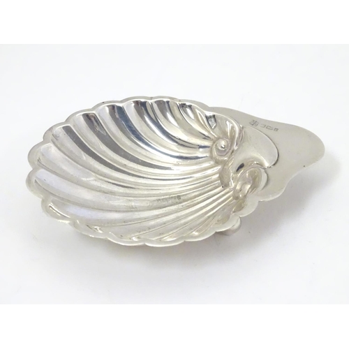 312 - A silver butter dish of shell form, hallmarked Sheffield 1901 maker  James Deakin & Sons (John & Wil... 