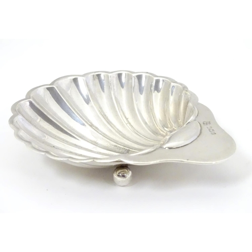 312 - A silver butter dish of shell form, hallmarked Sheffield 1901 maker  James Deakin & Sons (John & Wil... 