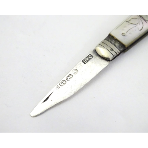 322 - A silver fruit knife with mother of pearl handle. Hallmarked Sheffield 1859 maker Brown & Clark . 2 ... 