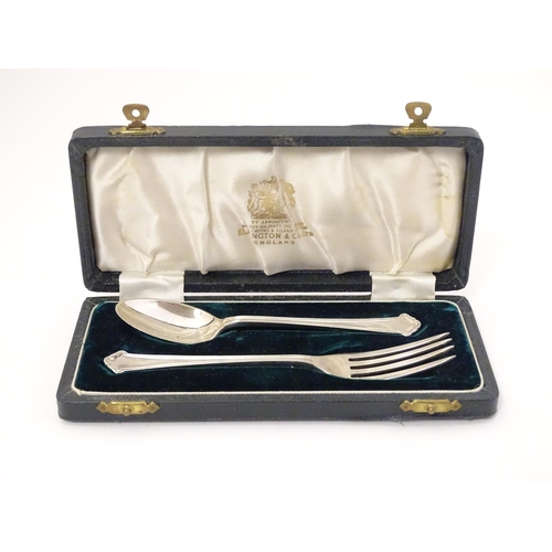 324 - A silver Christening set comprising spoon and fork, hallmarked Birmingham 1959, maker Elkington & Co... 