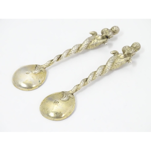 327 - An unusual pair of gilded white metal salt spoons, the bowls with crescent decoration and engraved a... 