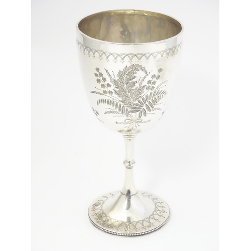 332 - A Victorian silver cup of goblet / chalice form. Hallmarked London 1874.  8