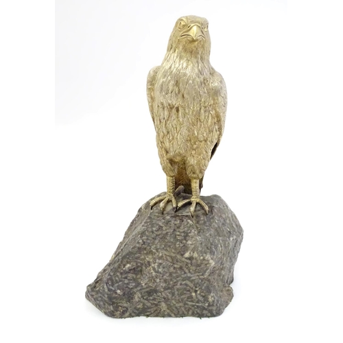 341 - A silver gilt model of a falcon bird mounted on a  granite rock formed base  Hallmarked London 1975 ... 