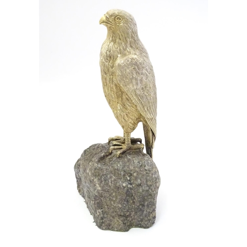 341 - A silver gilt model of a falcon bird mounted on a  granite rock formed base  Hallmarked London 1975 ... 