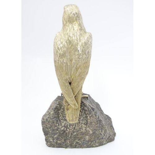 341 - A silver gilt model of a falcon bird mounted on a  granite rock formed base  Hallmarked London 1975 ... 