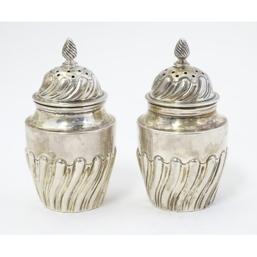 349 - A pair of Victorian silver pepperettes hallmarked Sheffield 1891 maker Harrison Brothers & Howson  2... 