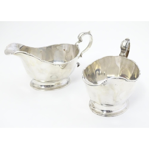 351 - A pair of silver sauce boats hallmarked Birmingham 1933 maker Mappin & Webb Ltd.  6 1/4