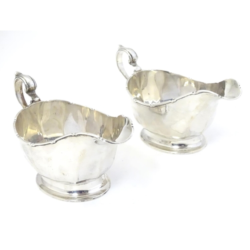 351 - A pair of silver sauce boats hallmarked Birmingham 1933 maker Mappin & Webb Ltd.  6 1/4