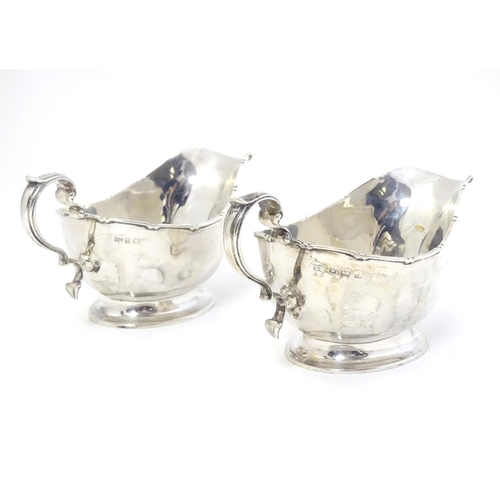 351 - A pair of silver sauce boats hallmarked Birmingham 1933 maker Mappin & Webb Ltd.  6 1/4