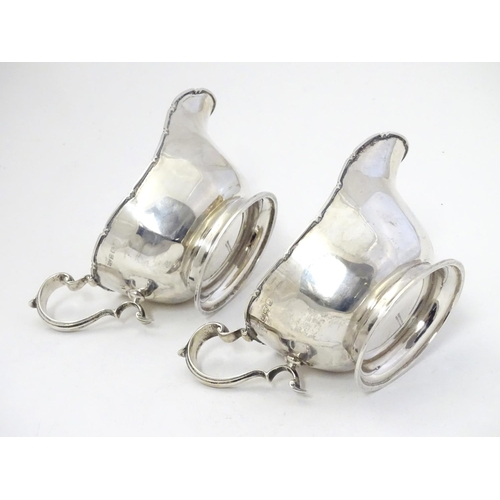 351 - A pair of silver sauce boats hallmarked Birmingham 1933 maker Mappin & Webb Ltd.  6 1/4