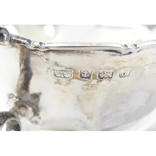 351 - A pair of silver sauce boats hallmarked Birmingham 1933 maker Mappin & Webb Ltd.  6 1/4