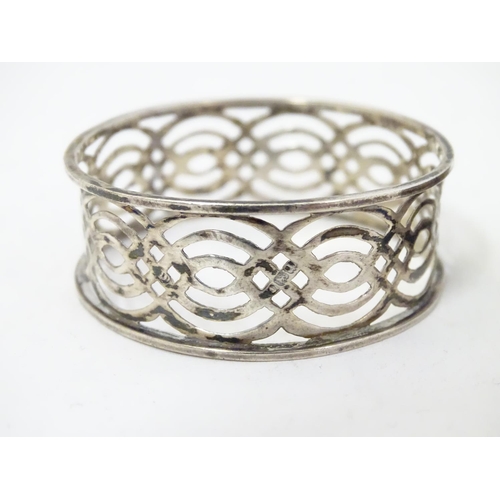 354 - Two silver napkin rings, one with pierced latticework decoration hallmarked Birmingham 1910 maker Wi... 