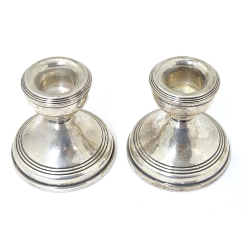 361 - A pair of short silver candlesticks, Hallmarked Birmingham 1968 maker W.I. Broadway & Co. Approx. 2 ... 