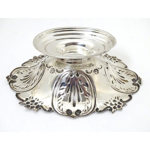 362 - A silver bonbon dish with C-scroll and foliate decoration raised on oval stepped base. Hallmarked Lo... 